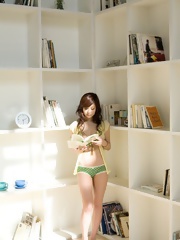 Beautiful Asian teen shows off her hot tight body in her bikini